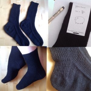 Hand knitted black socks in broken rib stitch pattern